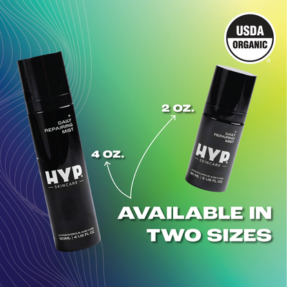 Promotional image featuring two bottles of 'HYP Daily Repairing Mist' against a gradient background transitioning from blue to green. The larger bottle on the left is annotated with '4 OZ.' and the smaller bottle on the right with '2 OZ.' An arrow points to each bottle from the bold white text at the bottom that reads 'AVAILABLE IN TWO SIZES.' The 'USDA ORGANIC' seal is displayed in the upper right corner of the image.